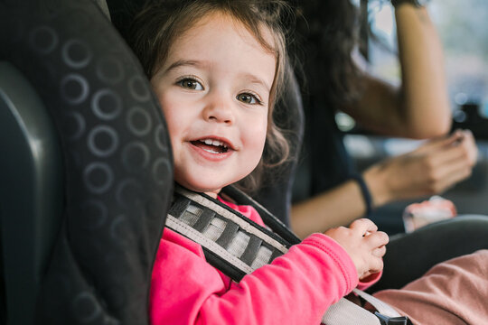 Backseat Adventures: Mother Entertaining Her Daughter in the Car