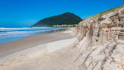 high tide eroding the dunes of Santinho beach in the city of Florianópolis Santa Catarina Brazil