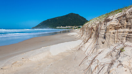 high tide eroding the dunes of Santinho beach in the city of Florianópolis Santa Catarina Brazil