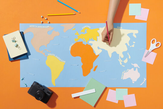 Woman at table with map and tourist equipment plan to travel
