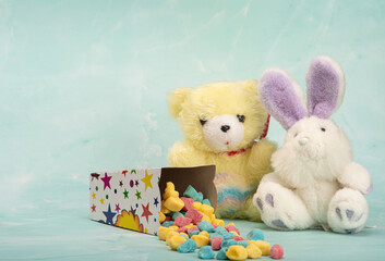 Sweets, beautiful colorful candies and accessories positioned on light surface, selective focus.