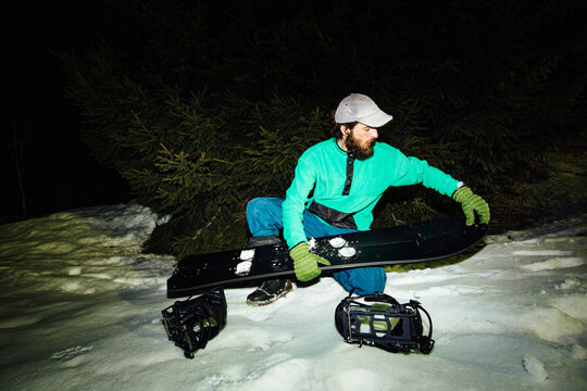 A man prepares his skis
