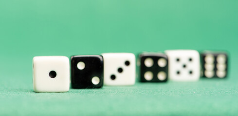 Dice, beautiful dice placed on green felt surface, selective focus.