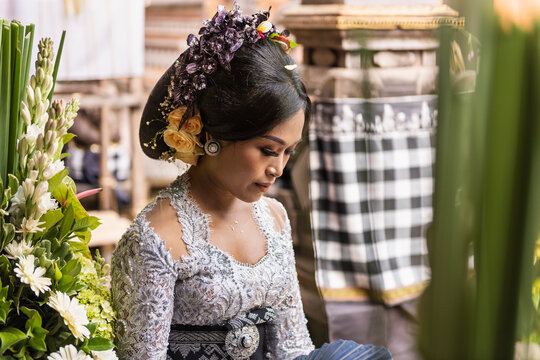 Balinese bride wearing traditional clothing at her  wedding ceremony