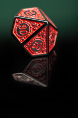 RPG dice, beautiful RPG dice placed on reflective surface and dark background, selective focus.