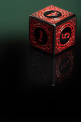 RPG dice, beautiful RPG dice placed on reflective surface and dark background, selective focus.