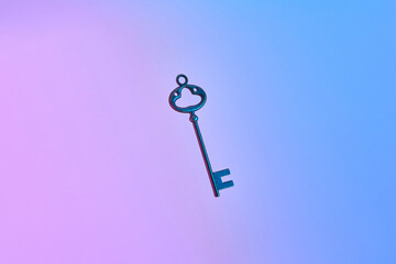 Retro key on neon gradient background.