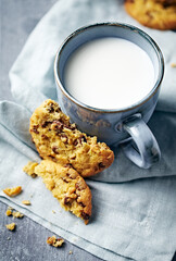 Chocolate chip cookies with hazelnuts and a cup of milk