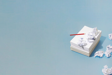 Writer´s block / creative block. Paper stack and creased papers 