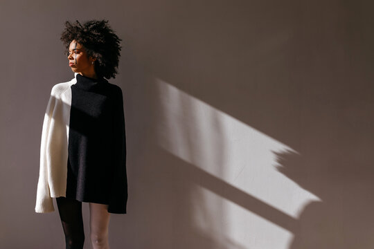 Woman wearing apparel with symmetrical design