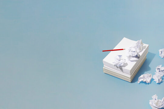 Writer´s block / creative block. Paper stack and creased papers 