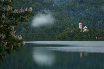 Fototapeta na wymiar Lake Bled Reflections and Triglav National Park, Spring Season Photo, Julian Alps Bled, Slovenia