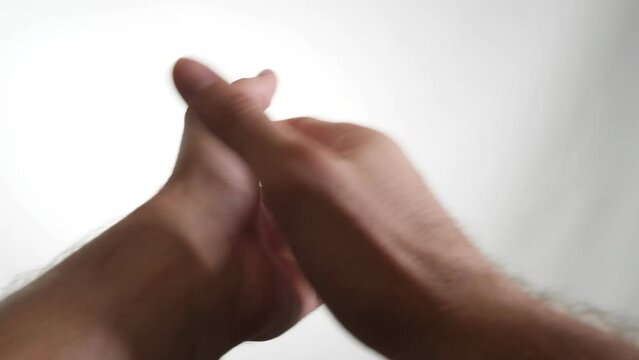 This video features a pair of hands clapping against a pure white background. Listen to the sharp and clear sound of each clap, beautifully captured in this auditory visual experience