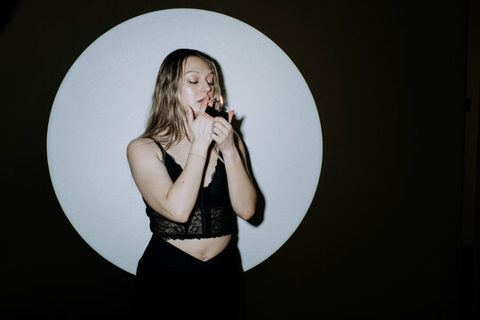 Attractive young woman smoking a cbd joint