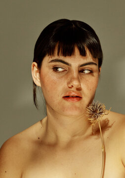 Woman looking to the side with distrust expression
