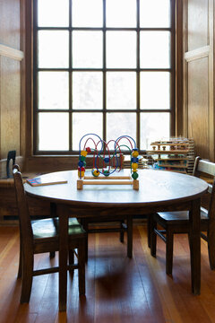 Table with Child Toy at window
