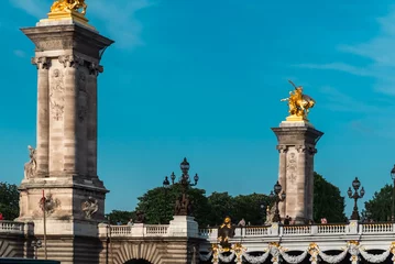 Foto op Plexiglas Pont Alexandre III Paris, France. April 22, 2022: Famous Alexander III Bridge with beautiful blue sky.