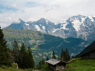 Fototapeta na wymiar Berner Oberland Mountain range with Eiger Mönch und Jungfrau at a Sunny Cloudy day in switzerland
