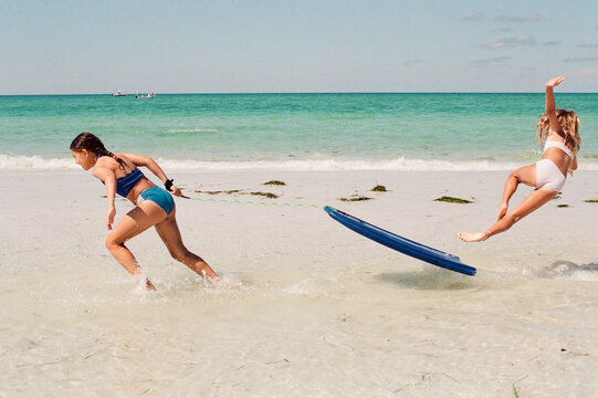 Girl falling off boogie board