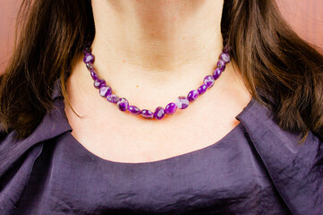 Women's jewelry made of purple stones.Women's necklace made of natural purple stones.Purple women's beads made of natural stone.