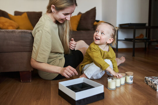 Boy and his mom are looking at candles