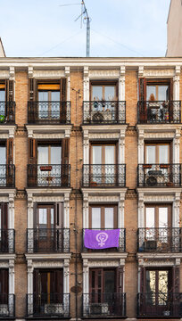 Purple Feminist Symbol On A Facade On The Streets.
