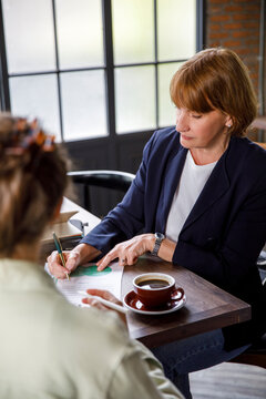Female boss making revisions to document
