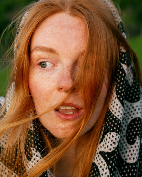 A close portrait of a red haired girl