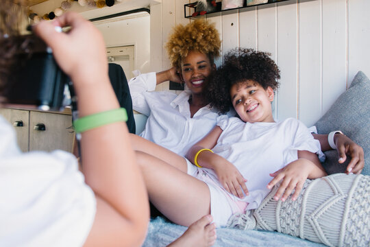 mother enjoying with her two daughters in a campervan