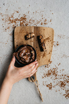 Hands taking cocoa cream