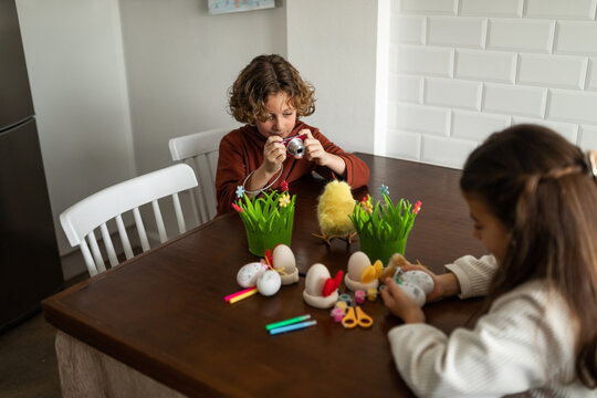 painting eggs on easter day