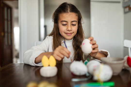 painting eggs on easter day