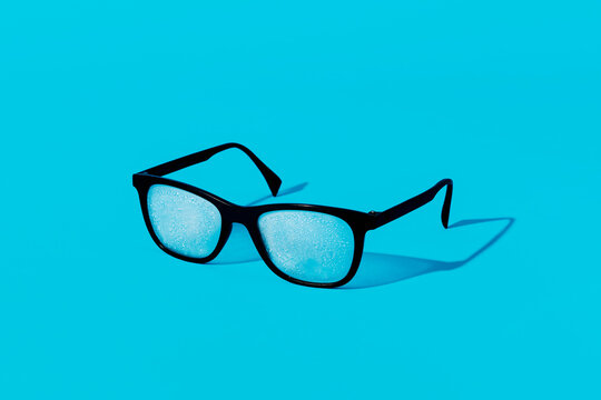 black eyeglasses with fog