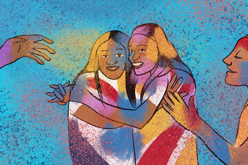 Women hugging during Holi festival