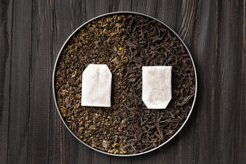 Composition of green, black tea and tea bags top view copy space