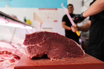 Raw meat on cutting board in factory