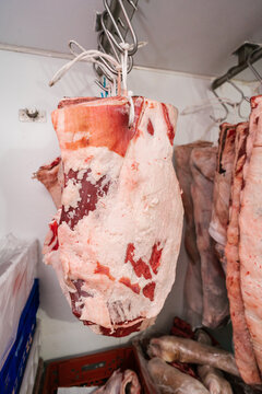 Raw meat pieces drying in butchery