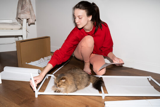 Assembling Furniture At Home Concept. New Apartment 