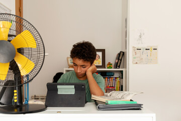 young boy studying at home