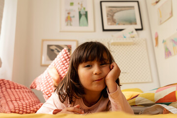 6 years old girl laying in bed