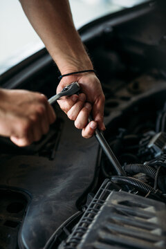 Mechanic Repairing Car