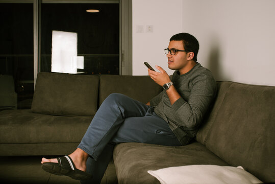Teenager Engaged in Evening Phone Conversation.