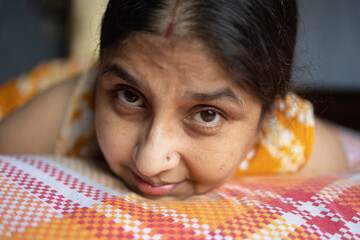 Candid expression of a middle aged Indian woman