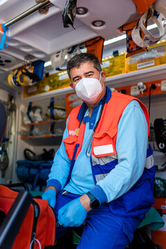 vertical portrait of a paramedic in an ambulance.