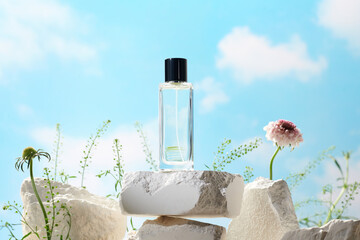 Glass perfume bottle on white podium