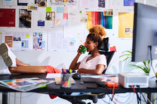 Businesswoman drink at workplace.