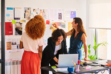 Colleagues work in studio.