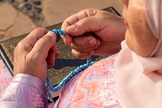 Grandmother holding sebha on Eid