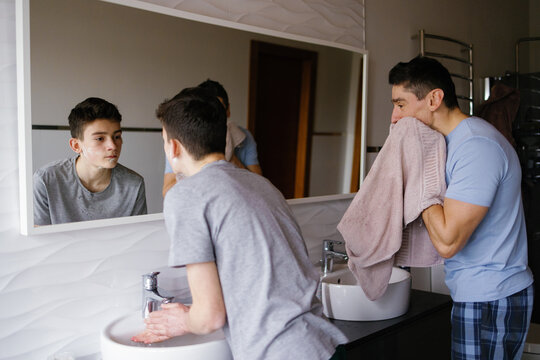 Father son adolescence grooming skin refresh morning ritual cleanse 