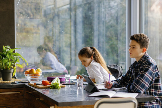 Student learn home together sibling kitchen daily routine  